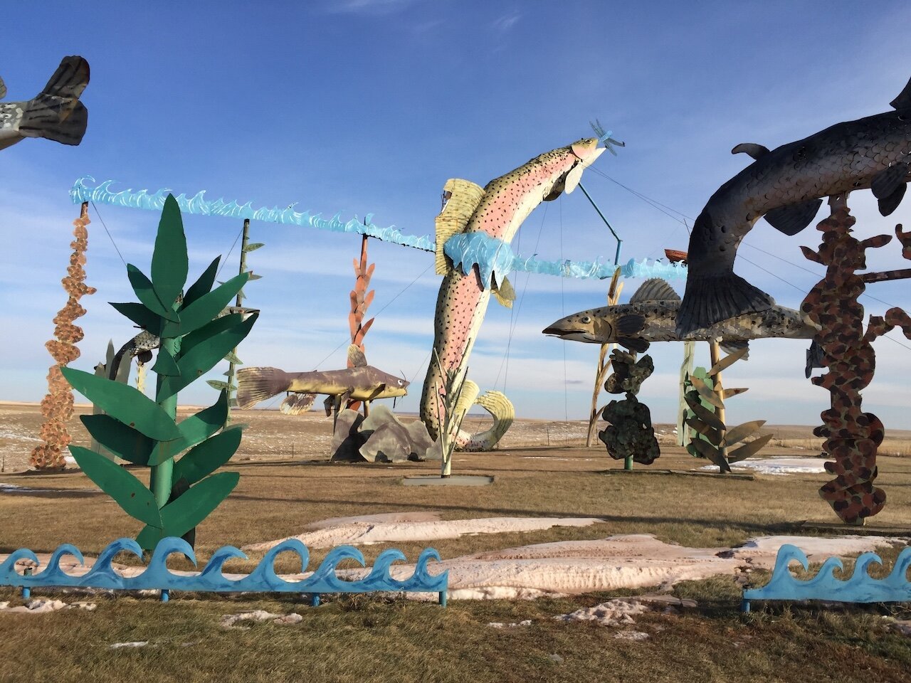 Title: Public Art Preserves Natural State Before Species Extinction

Alt Text: Photograph of public art in a partially snow-covered field depicting fish in their natural fauna. The sculptures are large and colorful.

Photographer: Marshall Mayer aka @AuthenticPhoto

Date and Time: November 24, 2014 at 1:15 pm

Location: on the Enchanted Highway north of Regent, ND  USA

License: CC BY-NC-ND 4.0

Caption: Environmental destruction by corporate agriculture and fossil fuel extraction is being forced on all the critters that call the American Northern Plains home. In not so many decades, the only access anglers will have to the species depicted in this public area will be this public art. 

#Anthropocene #HuntingAndFishing #ClimatEemergency #CulturalTourism #OutdoorRecreation#SpeciesExtinction #PublicArt  #Authentic #Photography

Source: https://take-note.com/note-takers/marshall--mayer/notes/public-art-preserves-natural-state-before-species-extinction/view