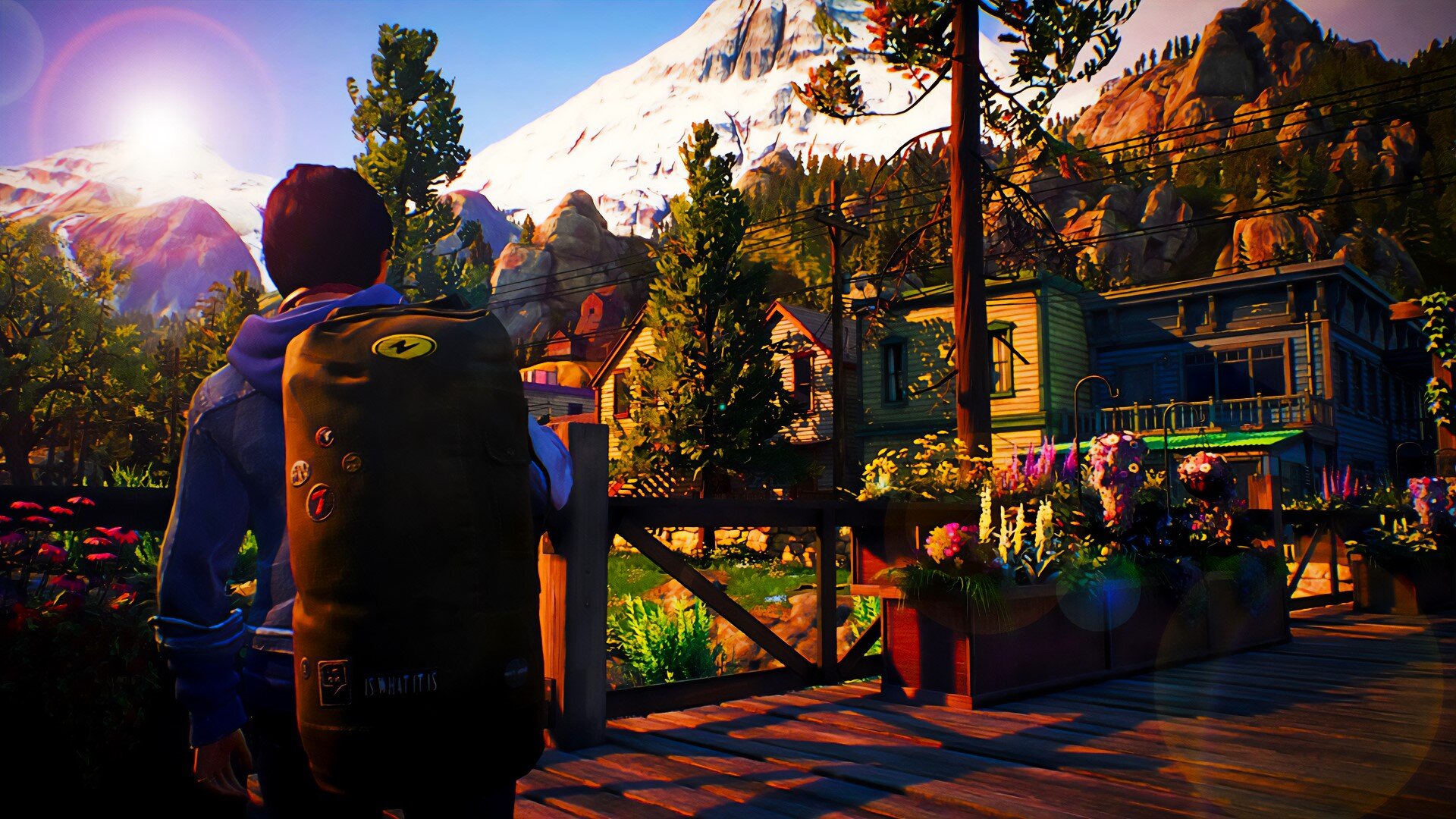Alex pauses on the bridge to take stock of her new home, Haven Springs, as the sun descends on the mountains.