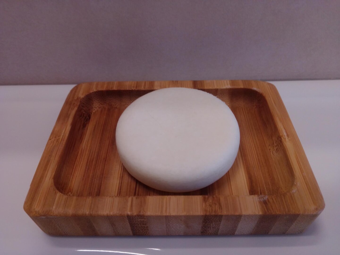 Owl & Bee shampoo bar on a wooden tray