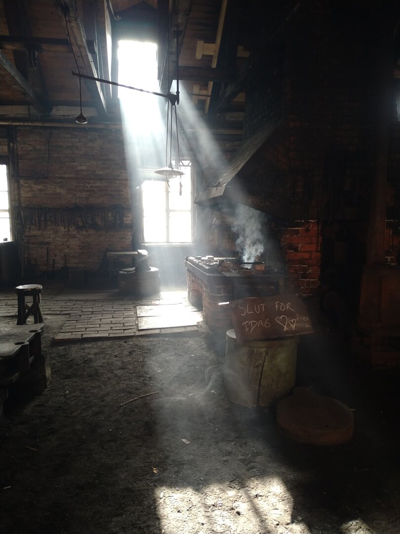 Epic rays of sunlight in a Smokey forge