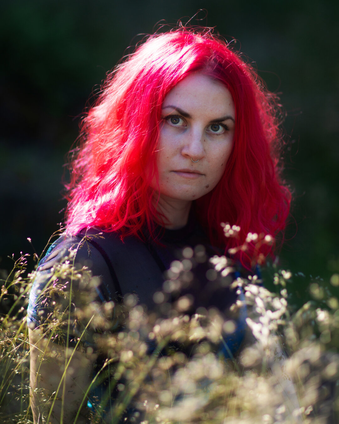 A nature portrait of a finnish red haired woman