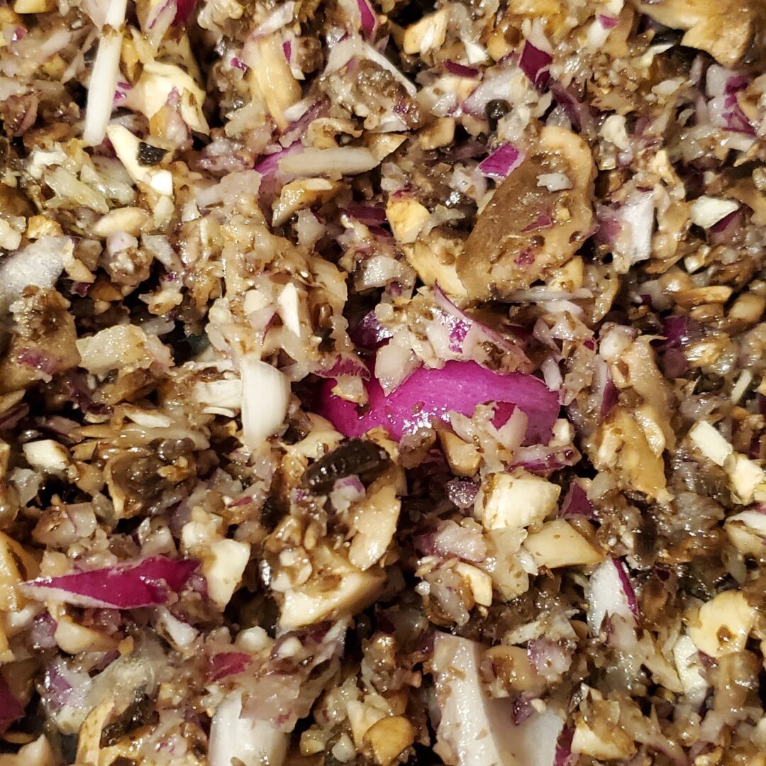 Mushrooms, garlic and red onions chopped and slowly sweating.