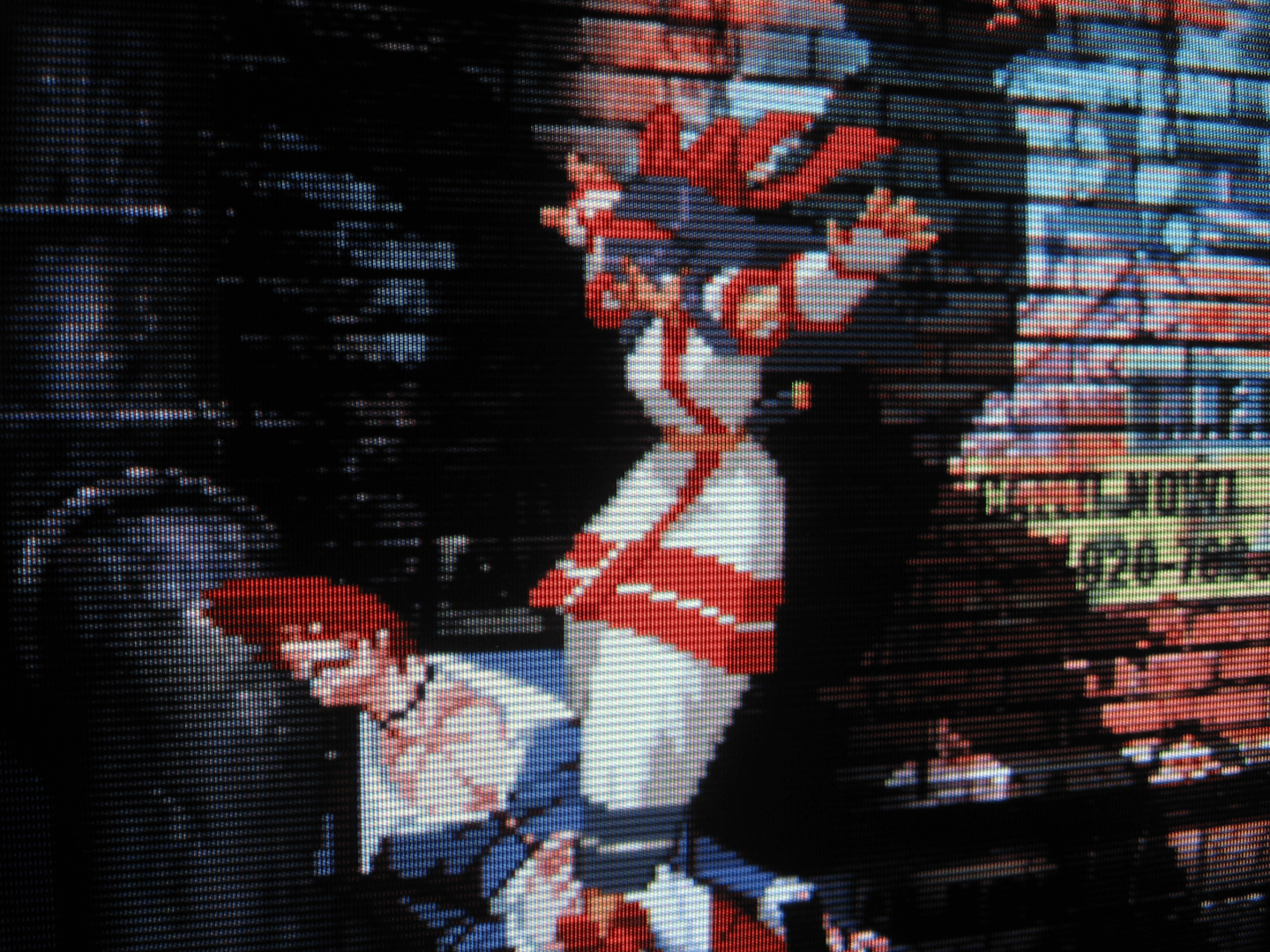 In a grimy alleyway cast against graffiti-covered brick and mortar, SNK's Nakoruru, cuter than she's ever been, stomps SNK's Iori Yagami in the crotch, contorting his demonic face as if he's been caught in the ghost trap from Ghostbusters (1984).