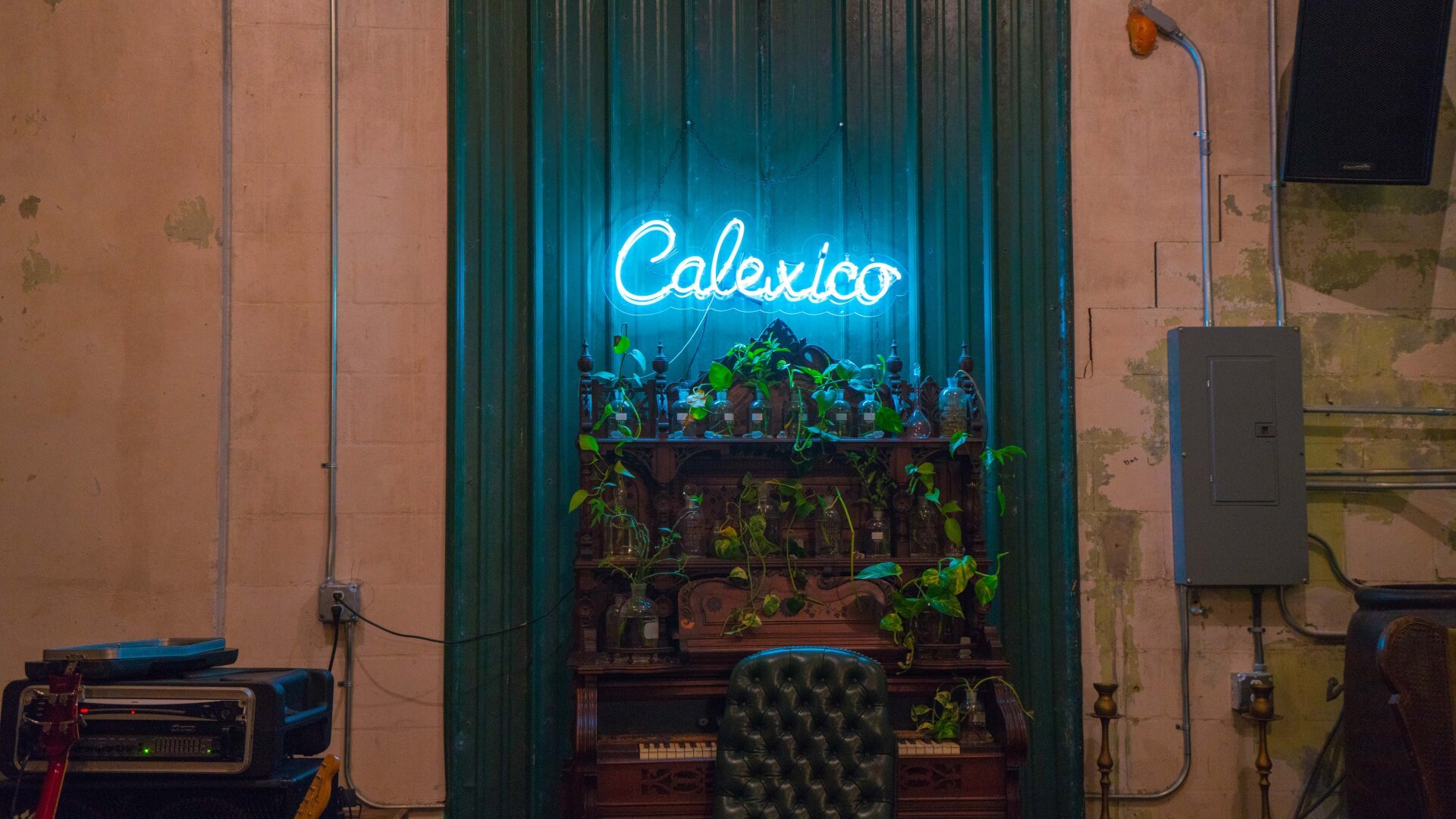 Neon sign that reads Calexico in a cozy coffee shop.