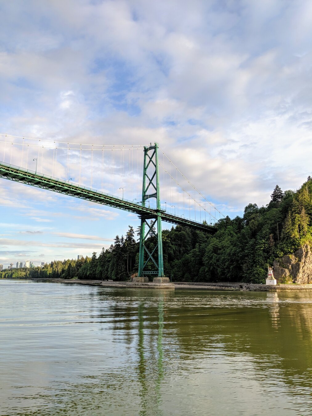 The Lions Gate Bridge is an Art Deco suspension bridge that connects Vancouver and North Vancouver in British Columbia, Canada. The photo is a view of the bridge from the water towards Stanley Park.