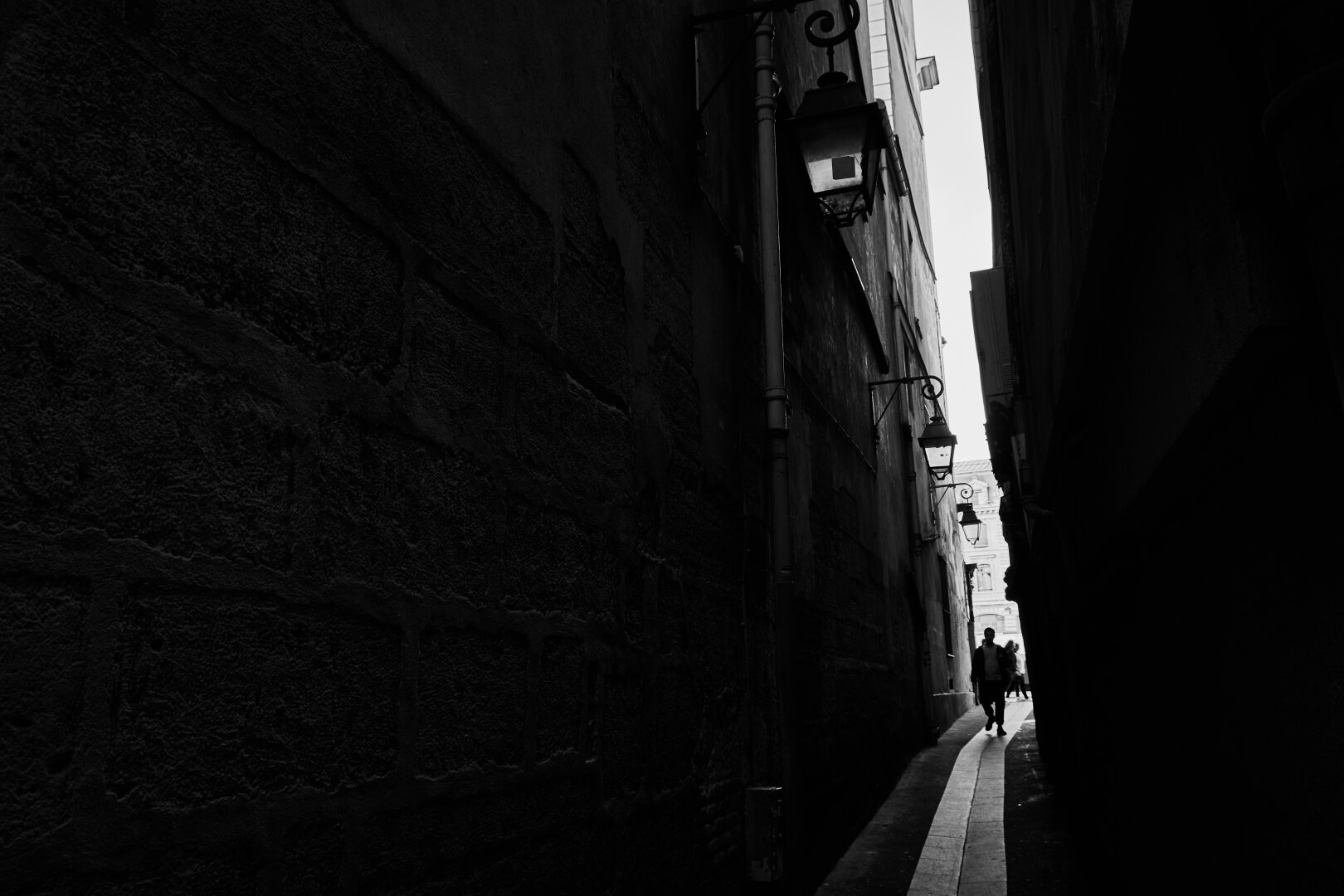 A very narrow alleyway in Paris, black and white photography.