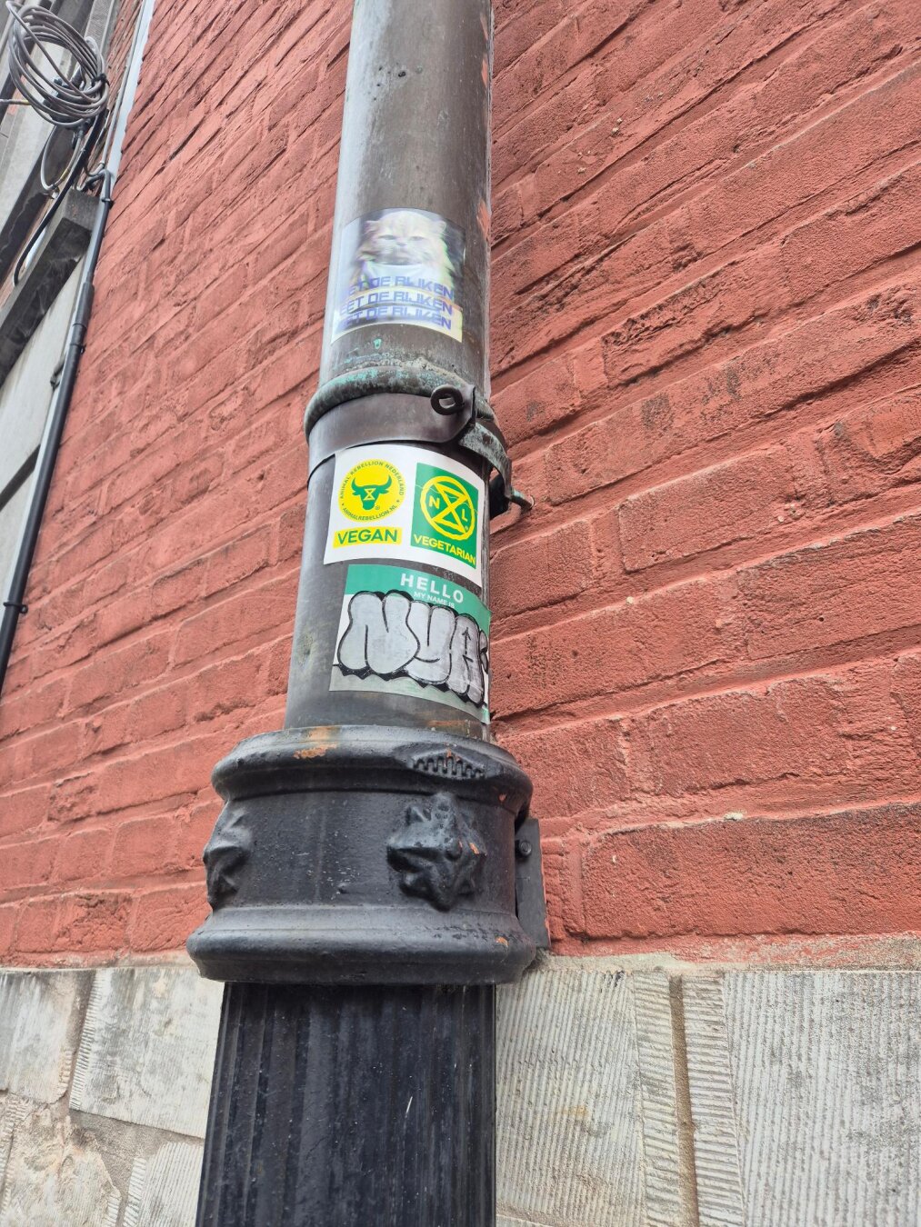 AR and XR collab sticker on rain drain pipe
