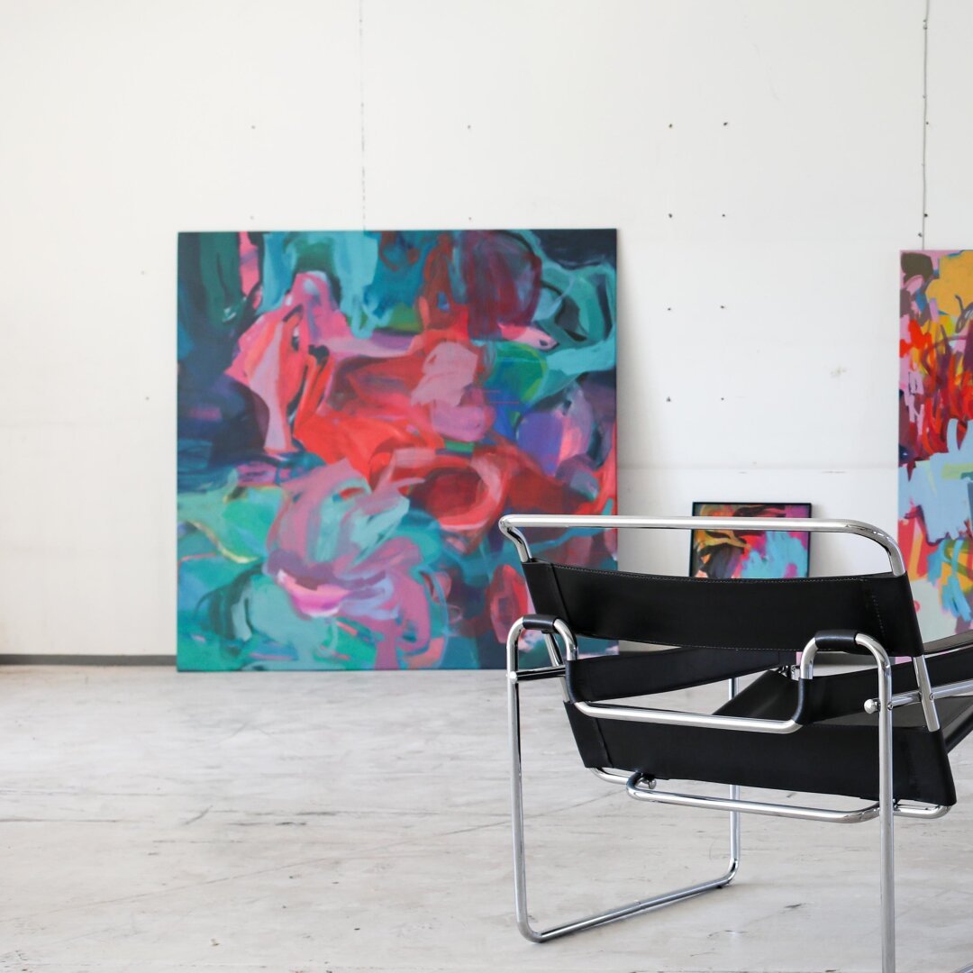 Large abstract painting in the back, Wassily chair in the front