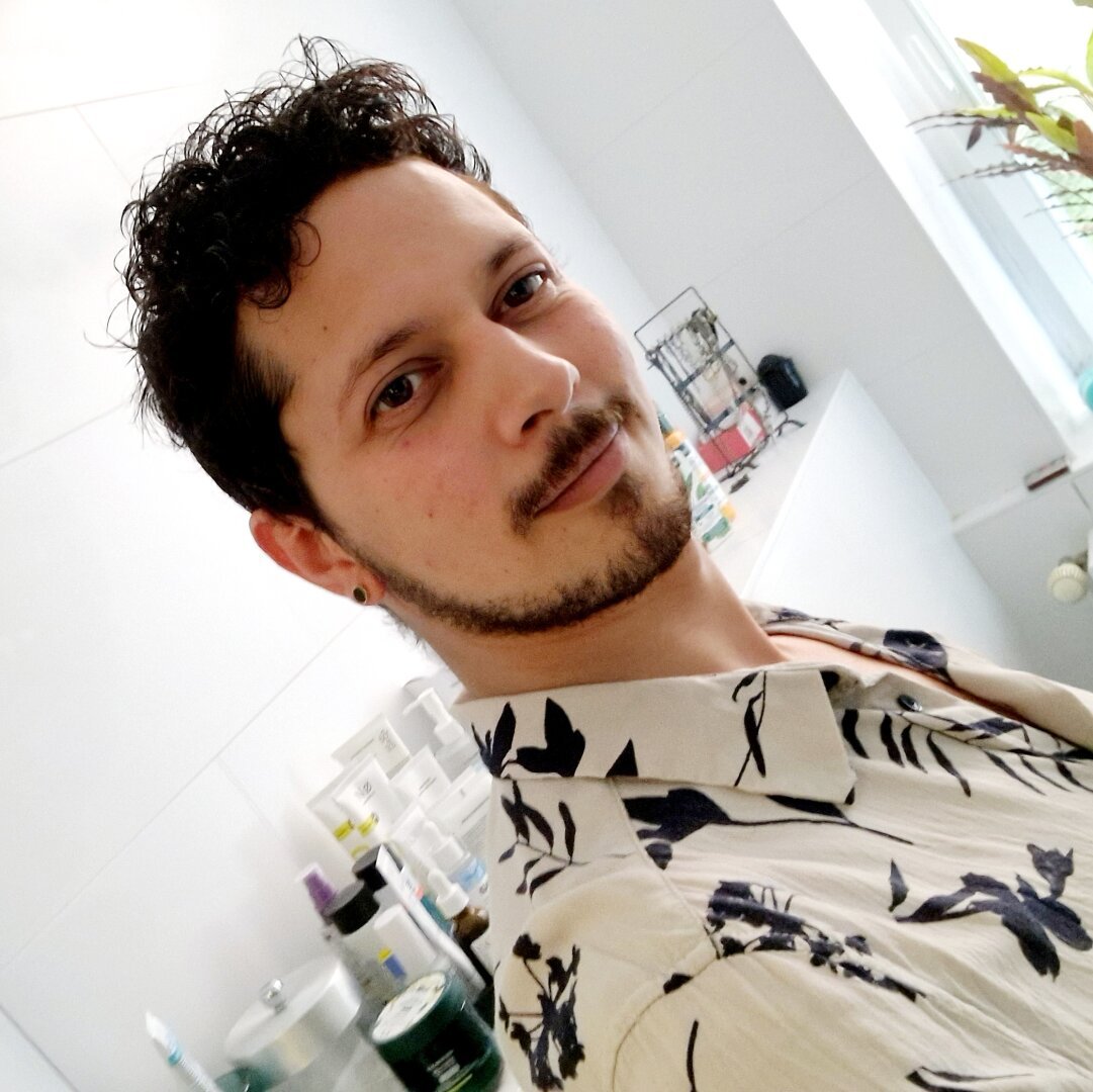 Amaru in self-portrait looking directly at the camera