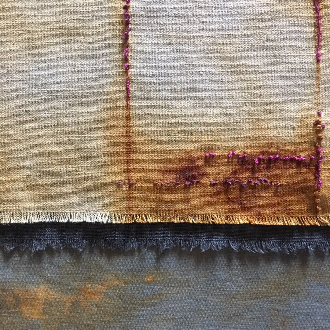 image of fabric that has been hand dyed then rusted with embroidery embellishments