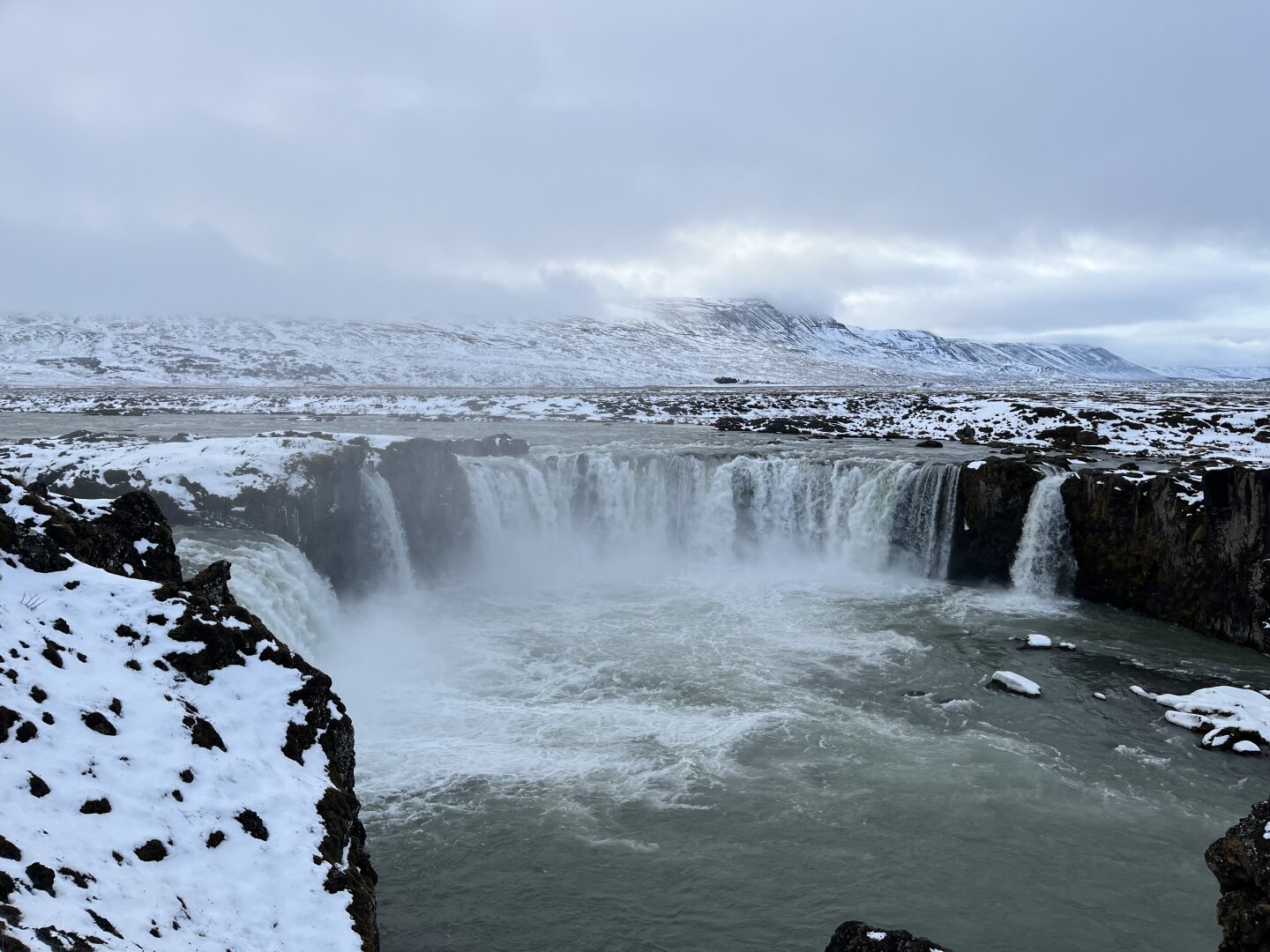 The Goðafoss waterfall in Iceland, in a snowy landscape