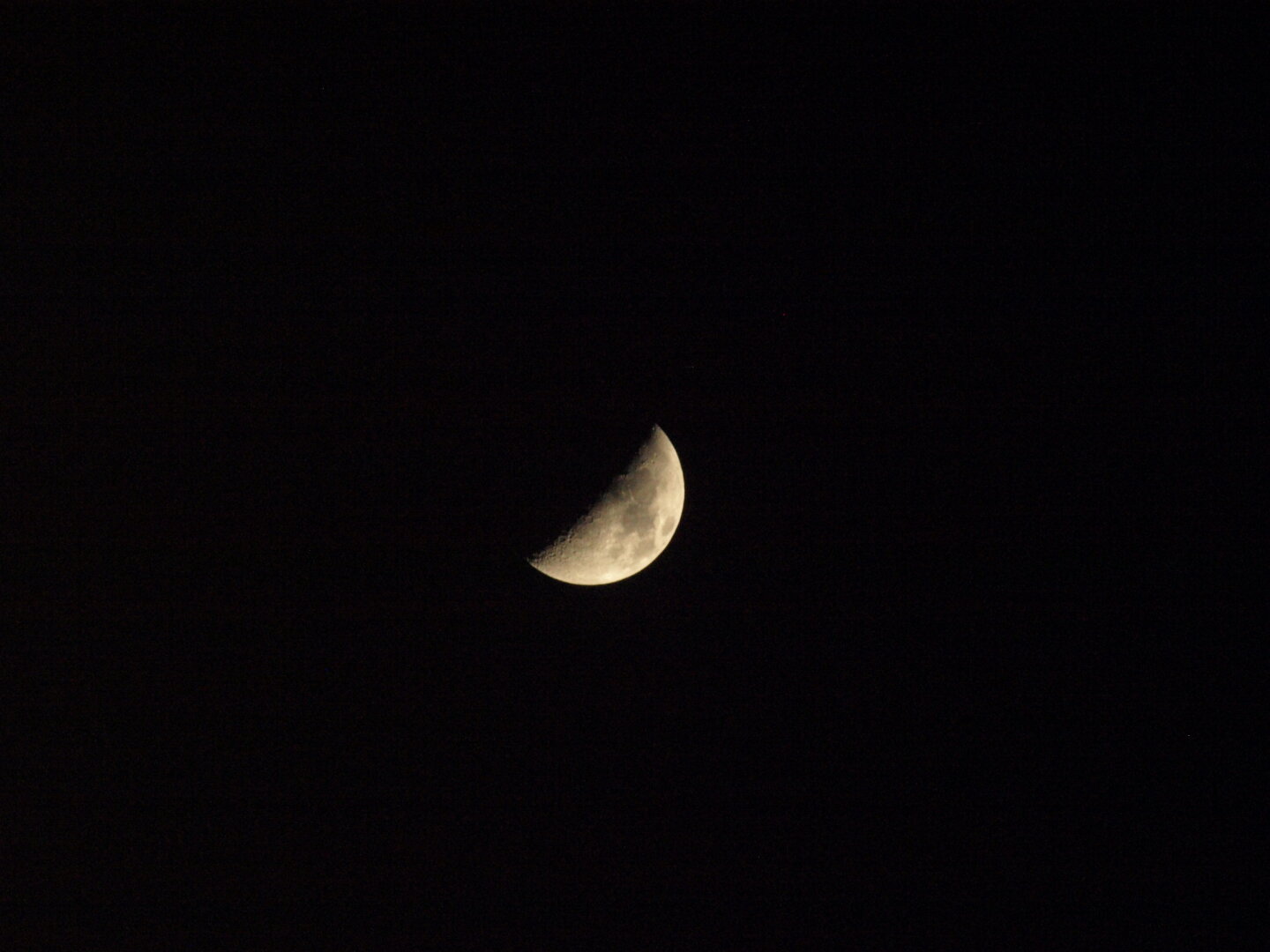 A picture of the waxing moon on the night sky