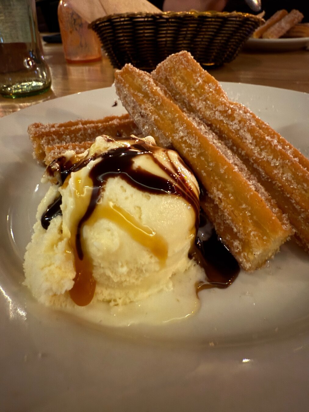 Churros served with vanilla ice cream