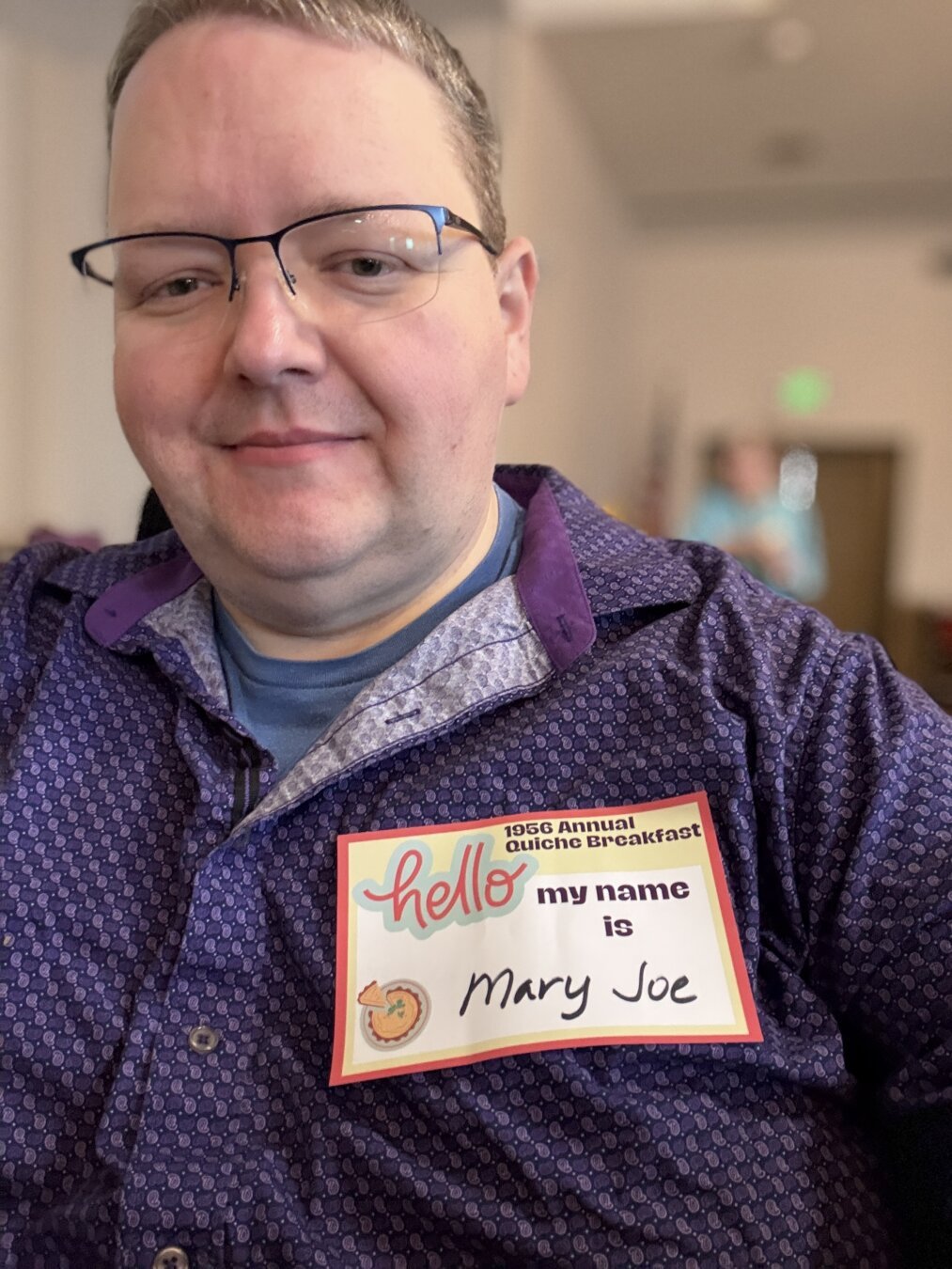Self portrait of me wearing a nametag saying I’m Mary Joe.