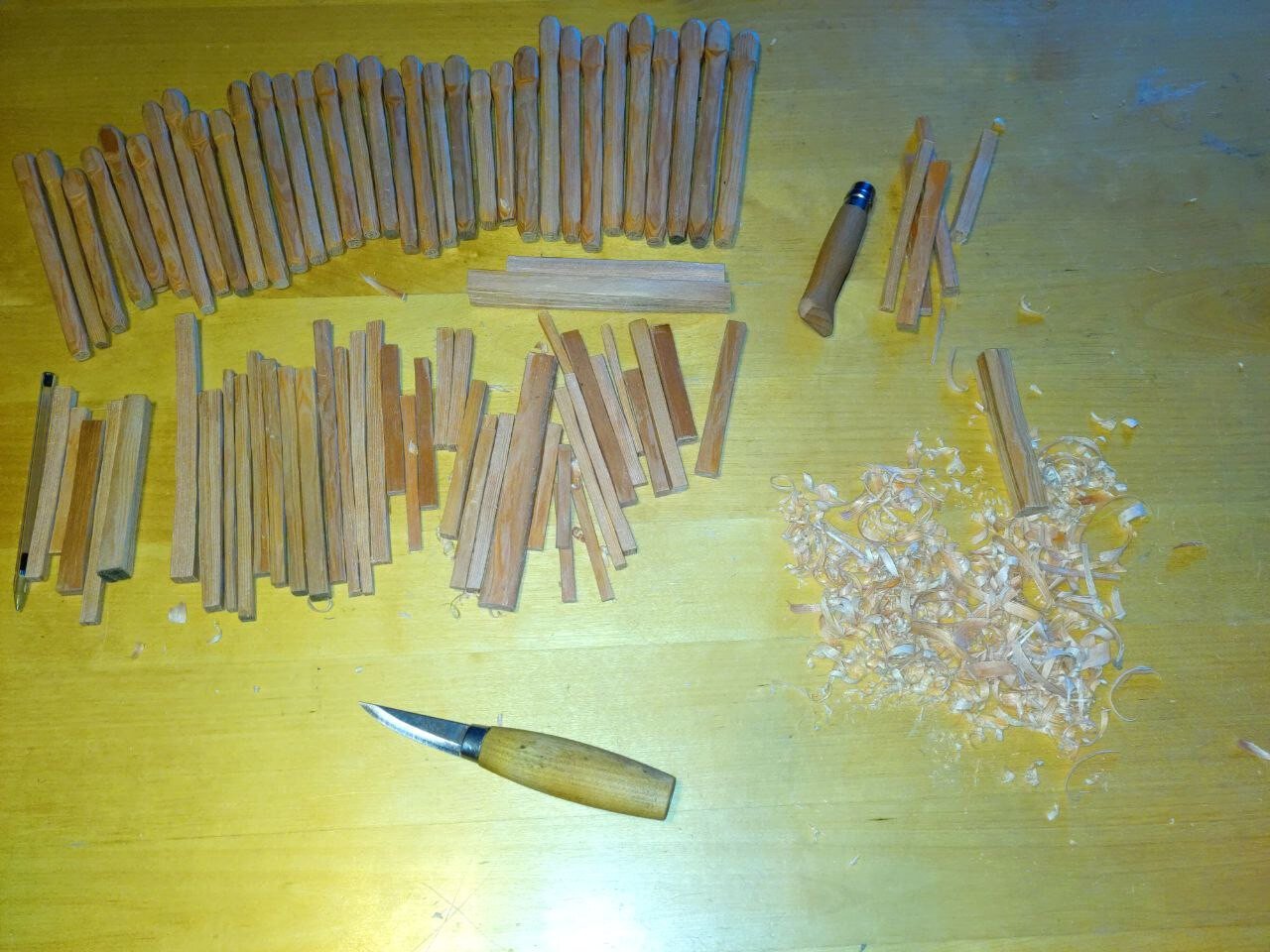 wood nails knive on table