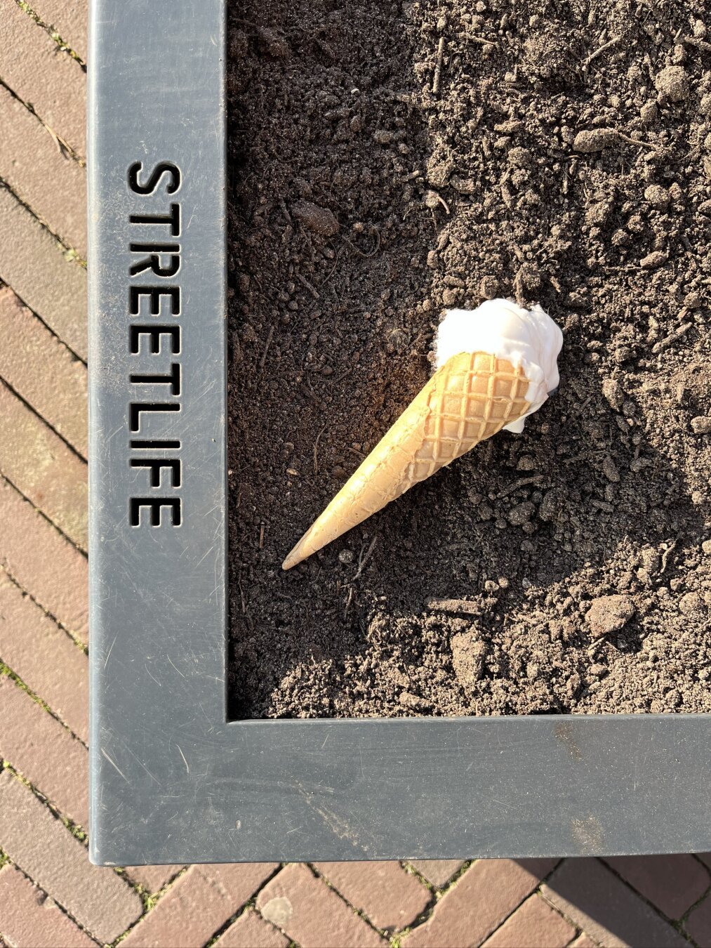 Icecream dropped in the sand