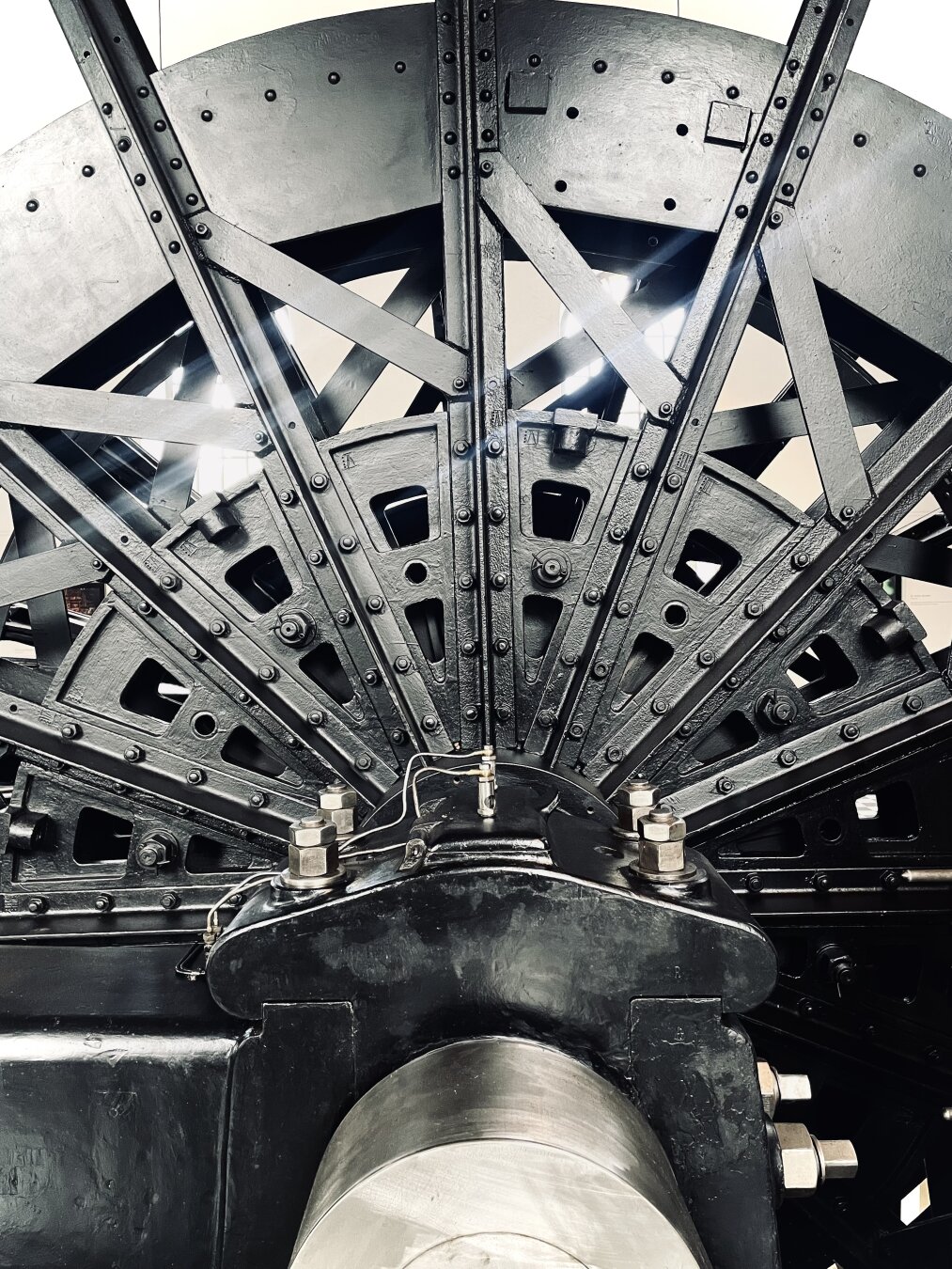 It is a photograph taken at the museum Zeche Nachtigall in Witten. The picture shows a side view of the big wheel of that winding engine.