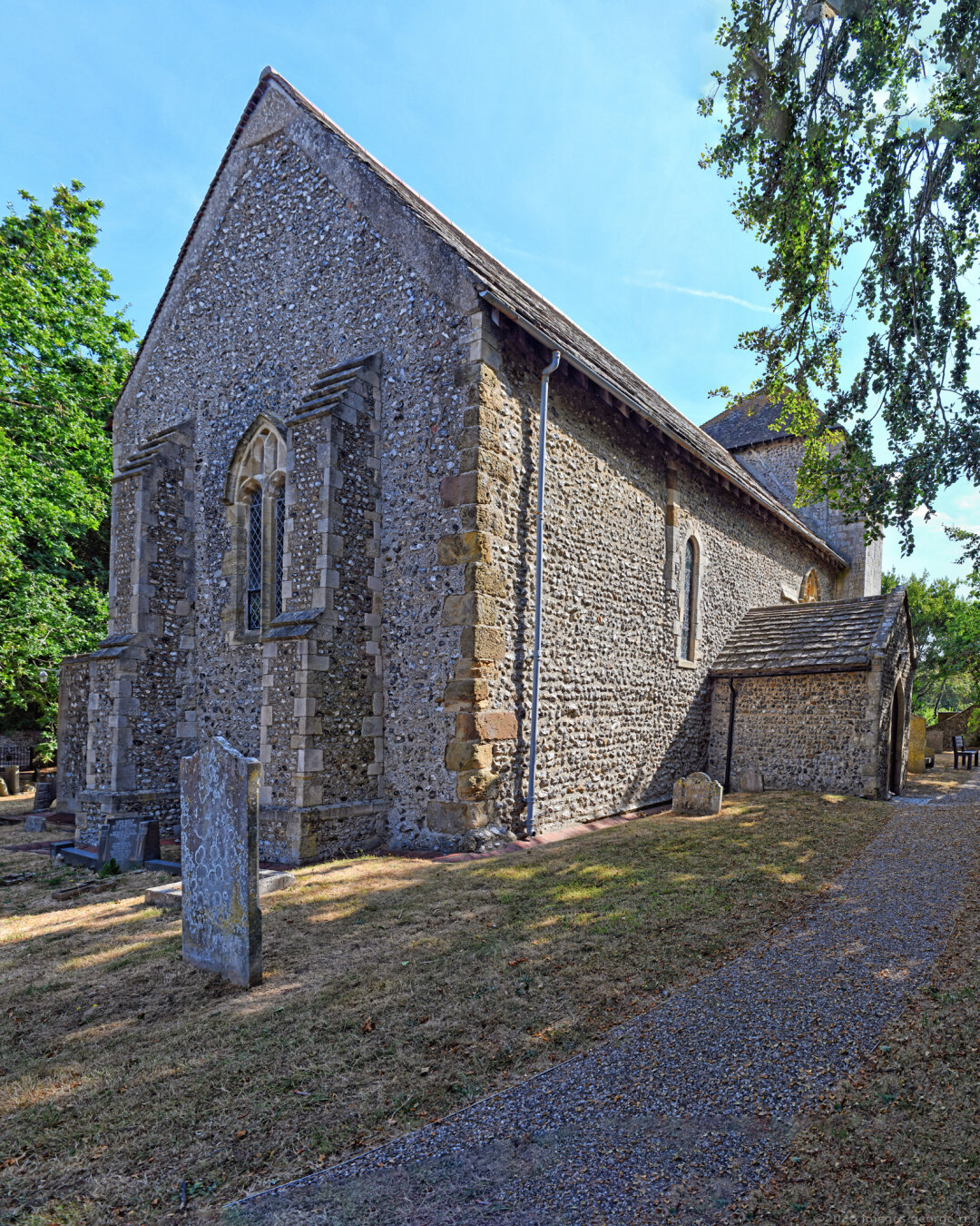 Grade 1 listed church dedicated to Julian of Le Mans. Thought to be one of the oldest churches in Sussex, with much of the present building from the C11 and C13. Remains from the earlier Saxon church were discovered in 1964. Flint with sandstone dressings and Horsham slab roof. Kingston Buci, West Sussex, UK.
