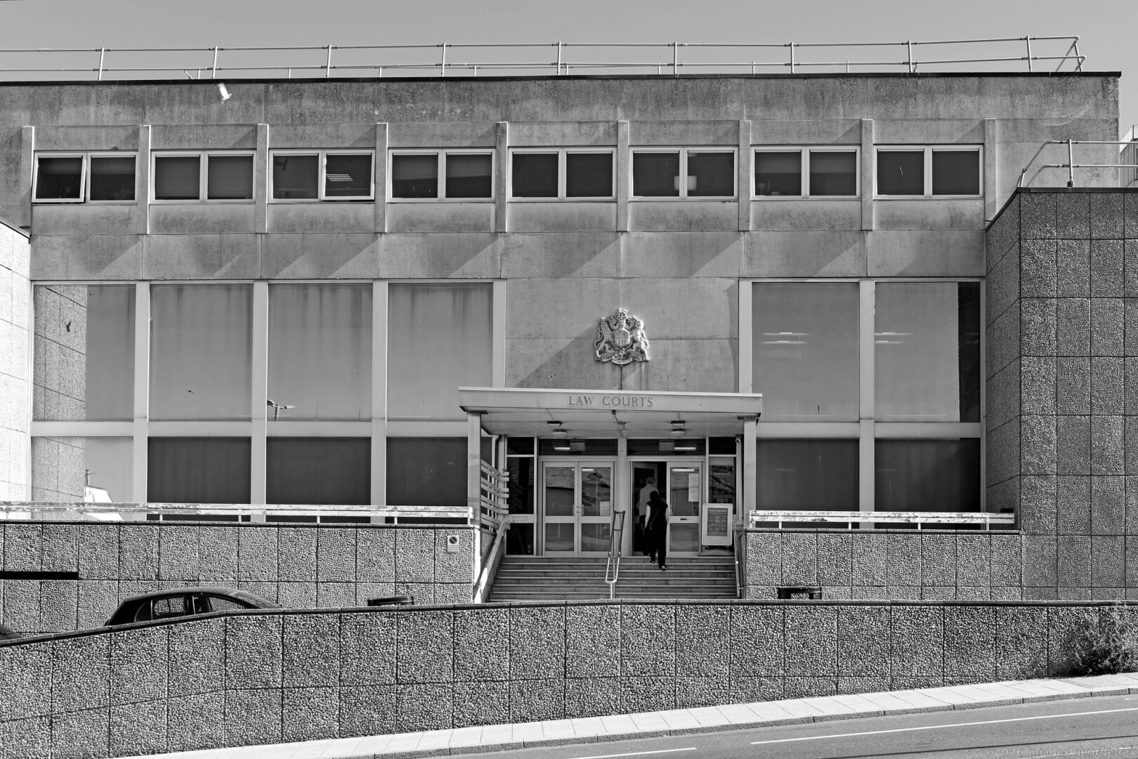 Monochrome photo of Brighton Law Courts on Edward street.  In the Brutalist style., remodelled 1986-89. Includes Crown and Magistrates' courts. City of Brighton & Hove.