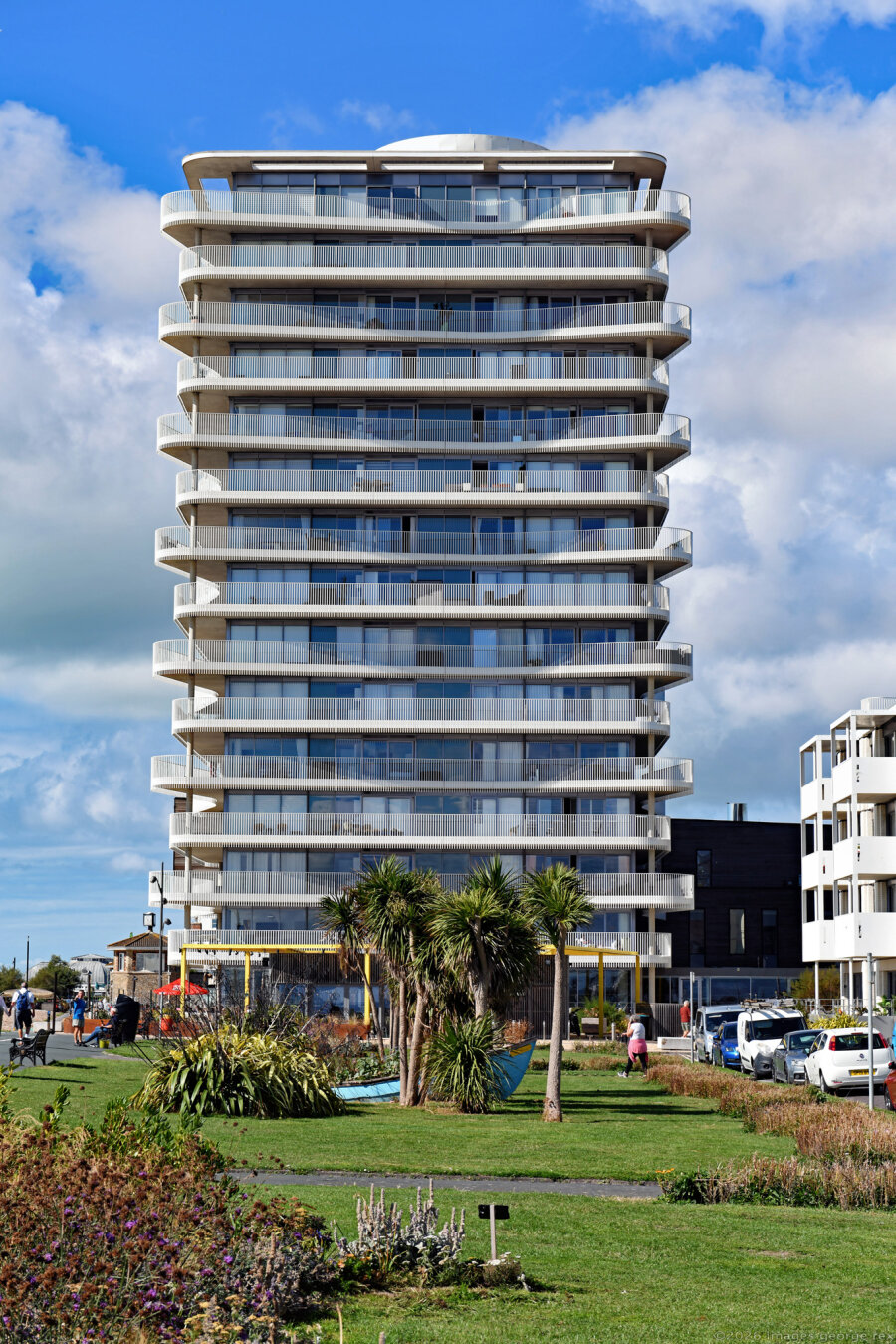 Photo of the east elevation of the Vista residential tower, part of the Bayside development. Architects: Allies & Morrison, 2021, for Roffey Homes.  Worthing, West Sussex, UK.