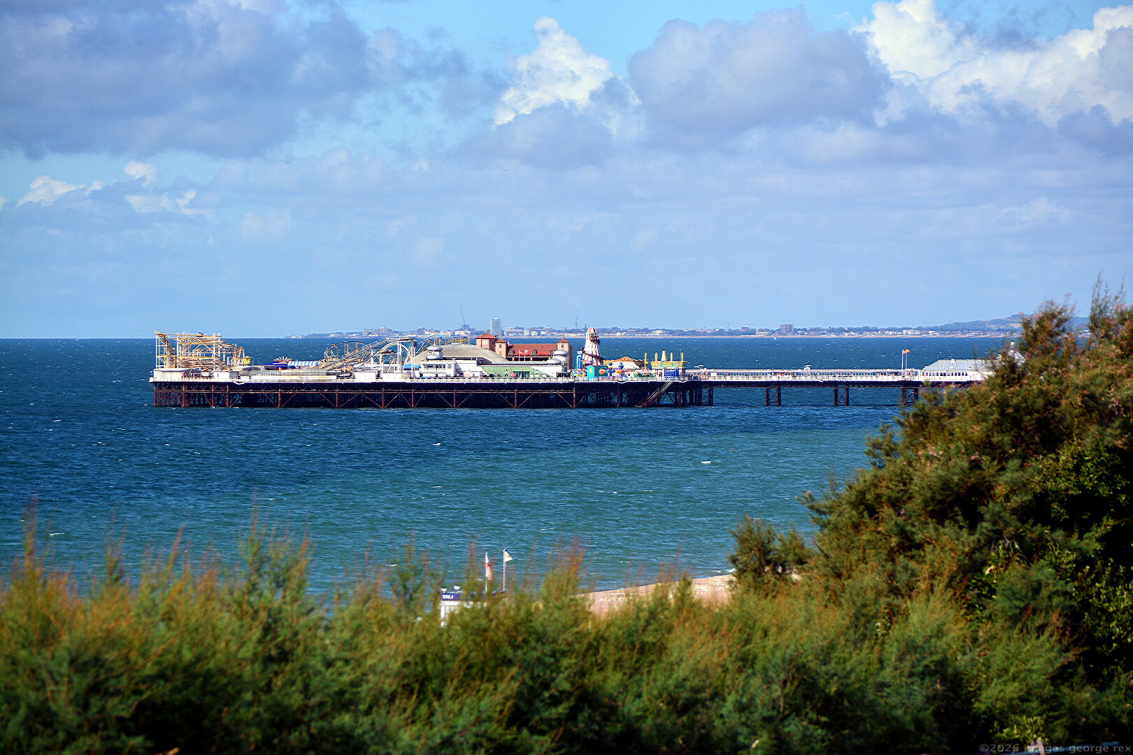 Photo from Duke's Mound looking west towards the Palace Pier by R. St George Moore, c.1899 and, in the distance, Worthing. City of Brighton & Hove, UK.