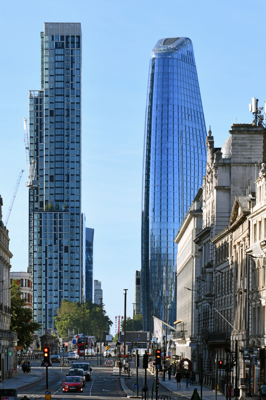 Photo showing on the left, Opus 50-storey residential tower designed by PLP Architecture, under construction at Bankside Yards. To the right  One Blackfriars designed by SimpsonHaugh and Partners, 2018. Both buildings in Southwark, but viewed from the City of London.