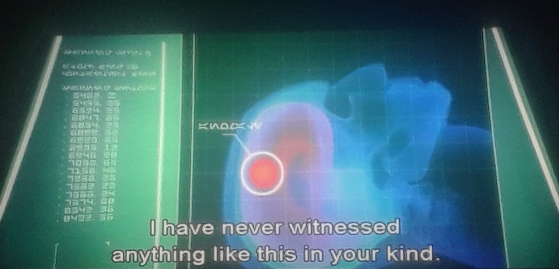 A shadowy figure, with his face obscured by a hood, appears in a hologram, speaking to a man with a beard, declaring "Destroy all evidence."