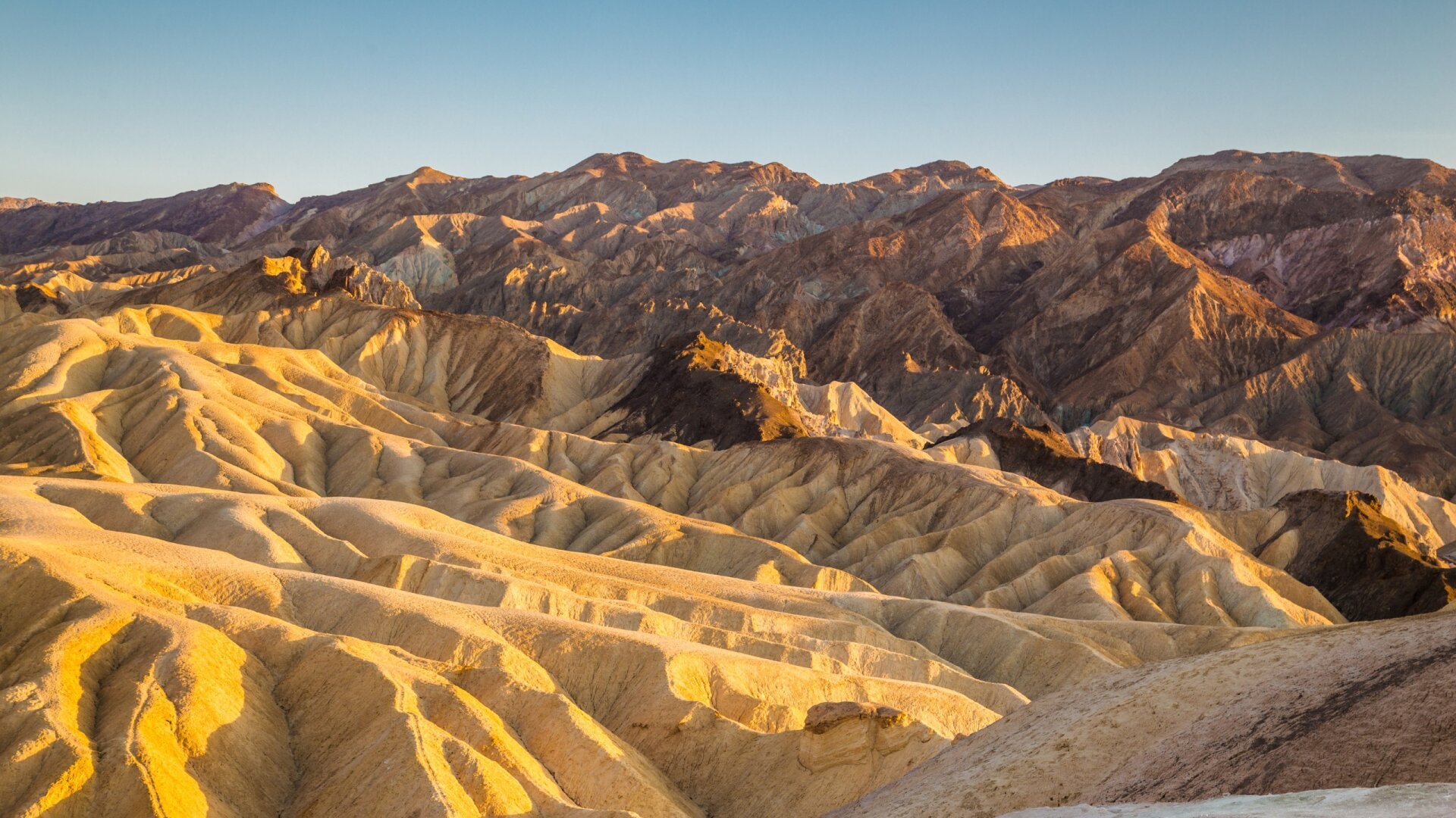 Yellow hills and mountains at Death Valley National Park.