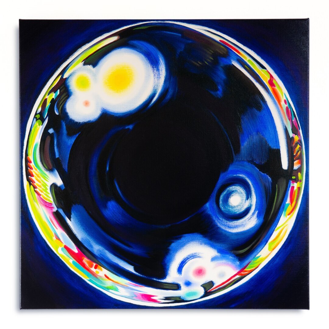 The photo depicts a square painting. The painting contains a dark background, in front of which a glass-like orb is seen. The edges of the glass orb playfully reflect the lights and colors of its surroundings. The center of the orb however is dark, it feels very calming and still.
