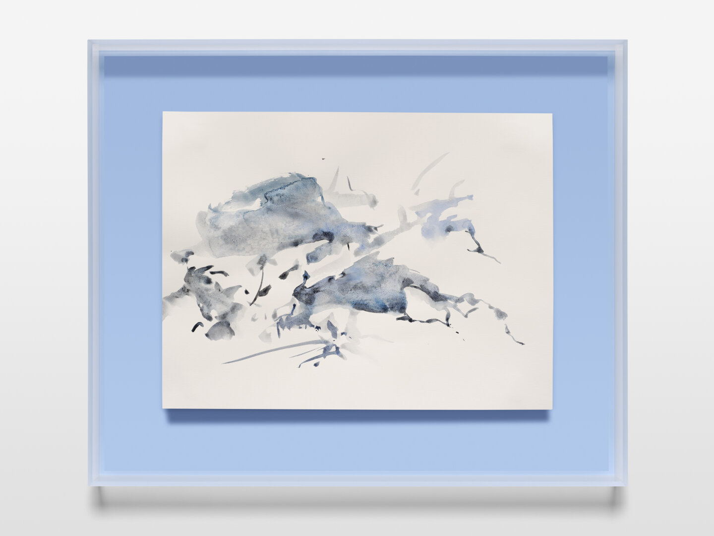 We see an abstract snowy landscape in watercolour. The main colours are blue, grey and white. The white paper is part of the artistic composition. The sheet is framed on a light blue background.
