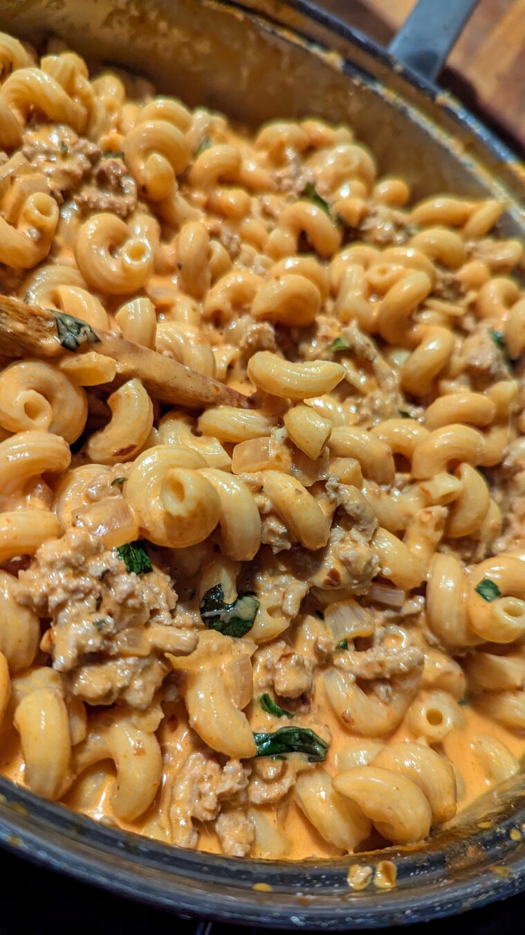 spicy vodka sauce pasta with ground turkey and fresh basil served over cavatappi