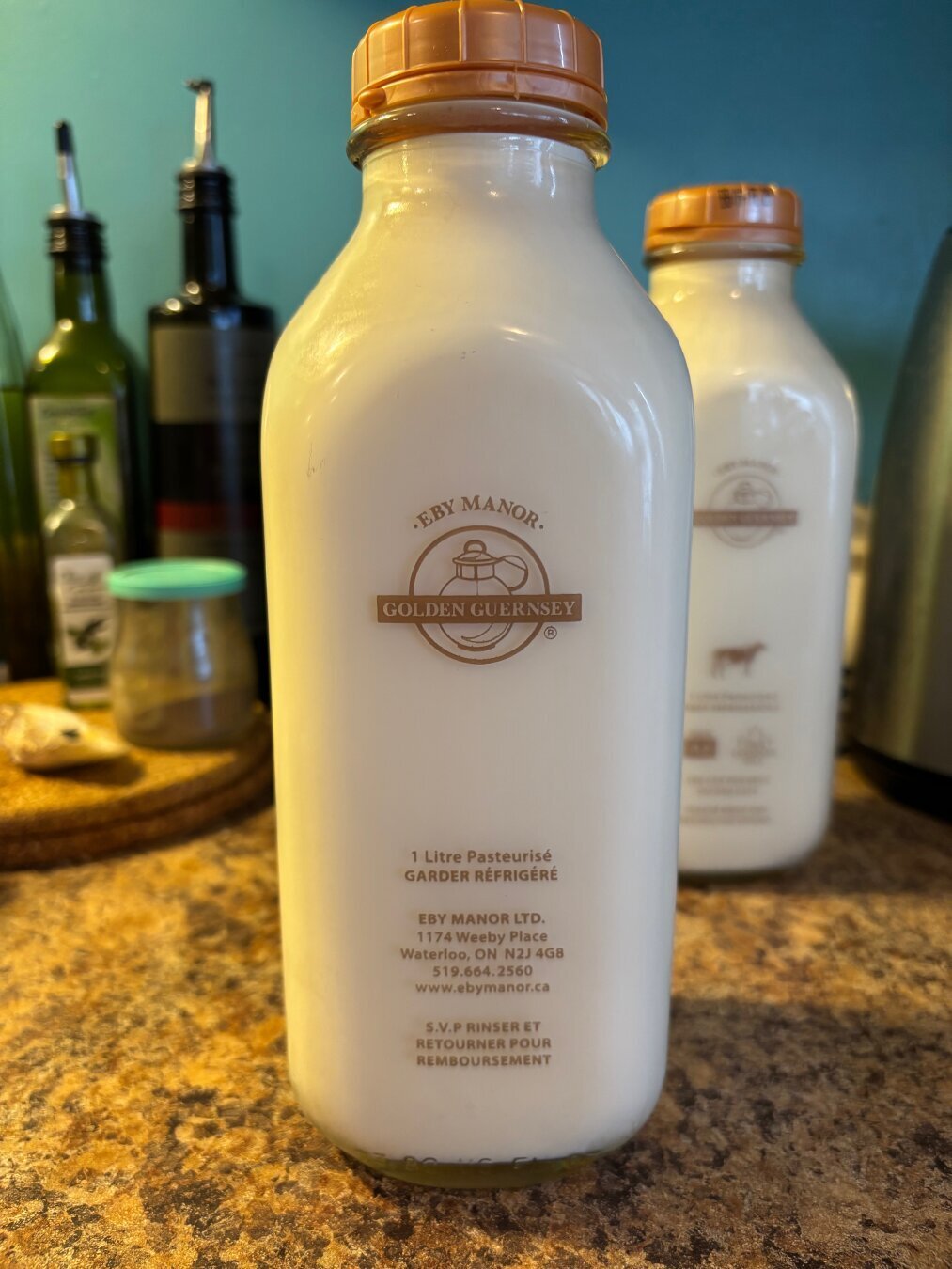 Two bottles of Eby Manor 4.8% milk in glass bottles (cream top, too!)