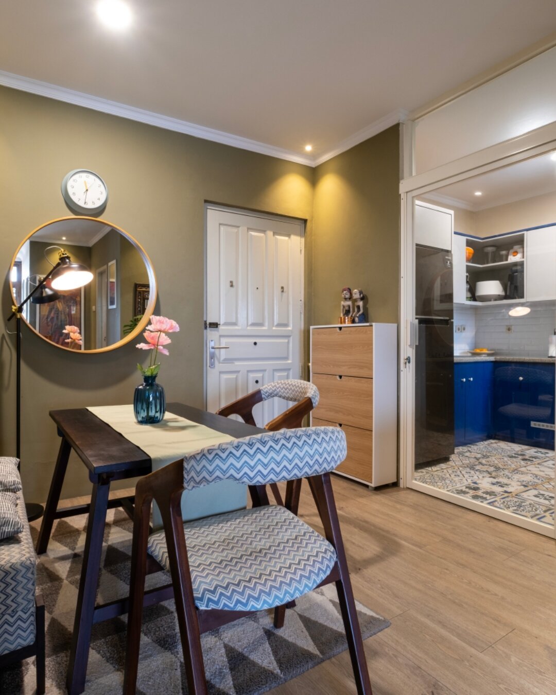 Dining area setup for up to four people, featuring two chairs and a bench.