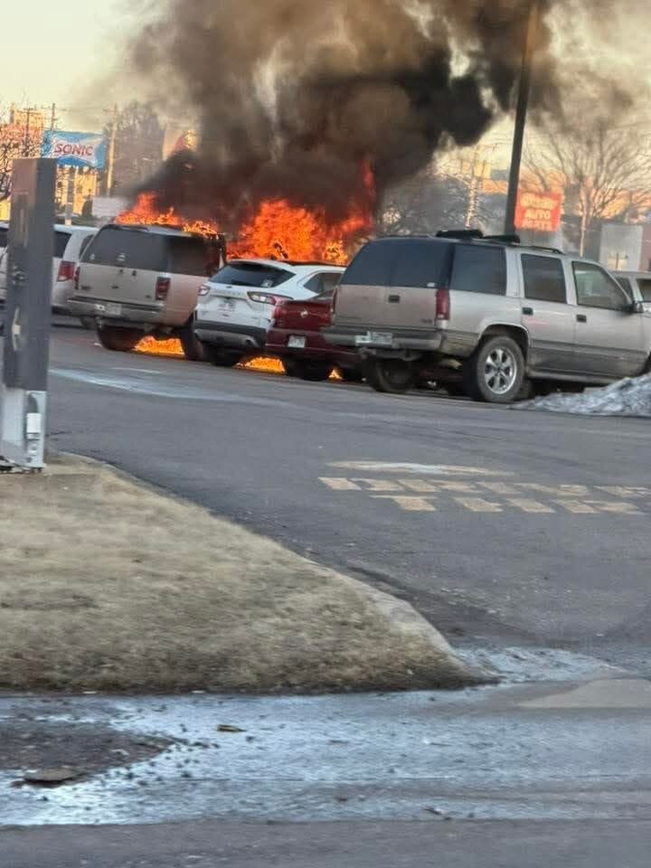 A vehicle catches nearby vehicles on fire in a parking lot