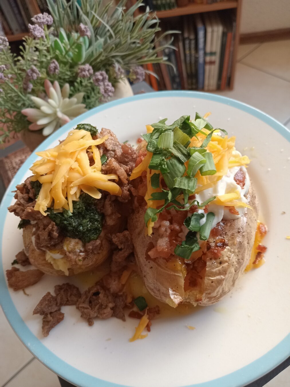 2 baked potatoes with toppings