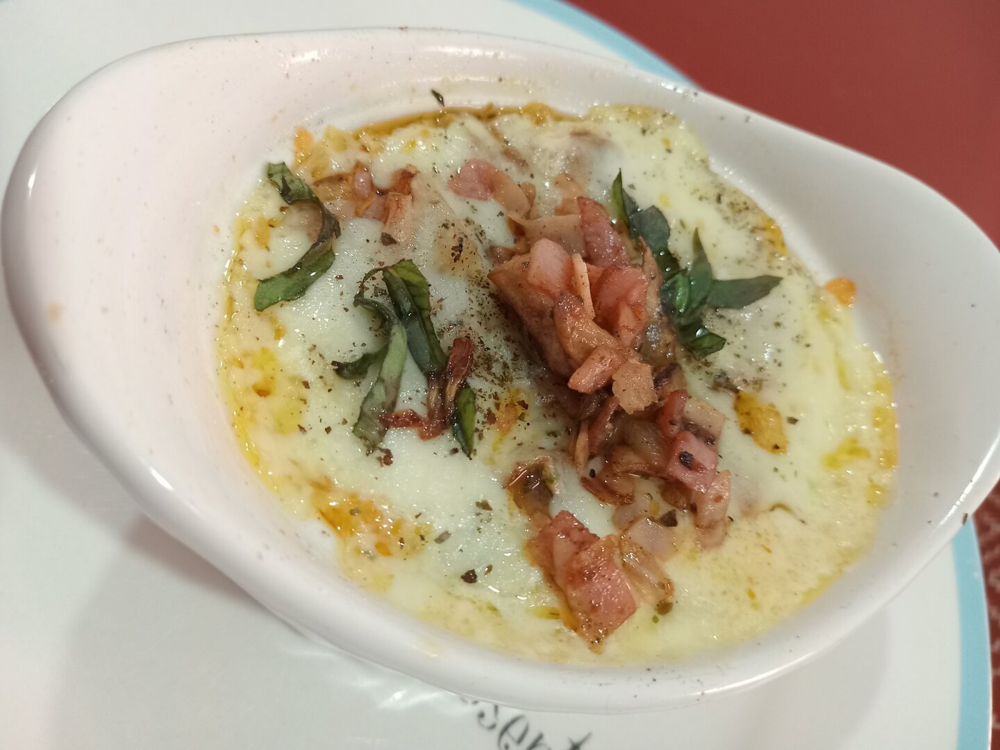 baked eggs with cream bacon and basil