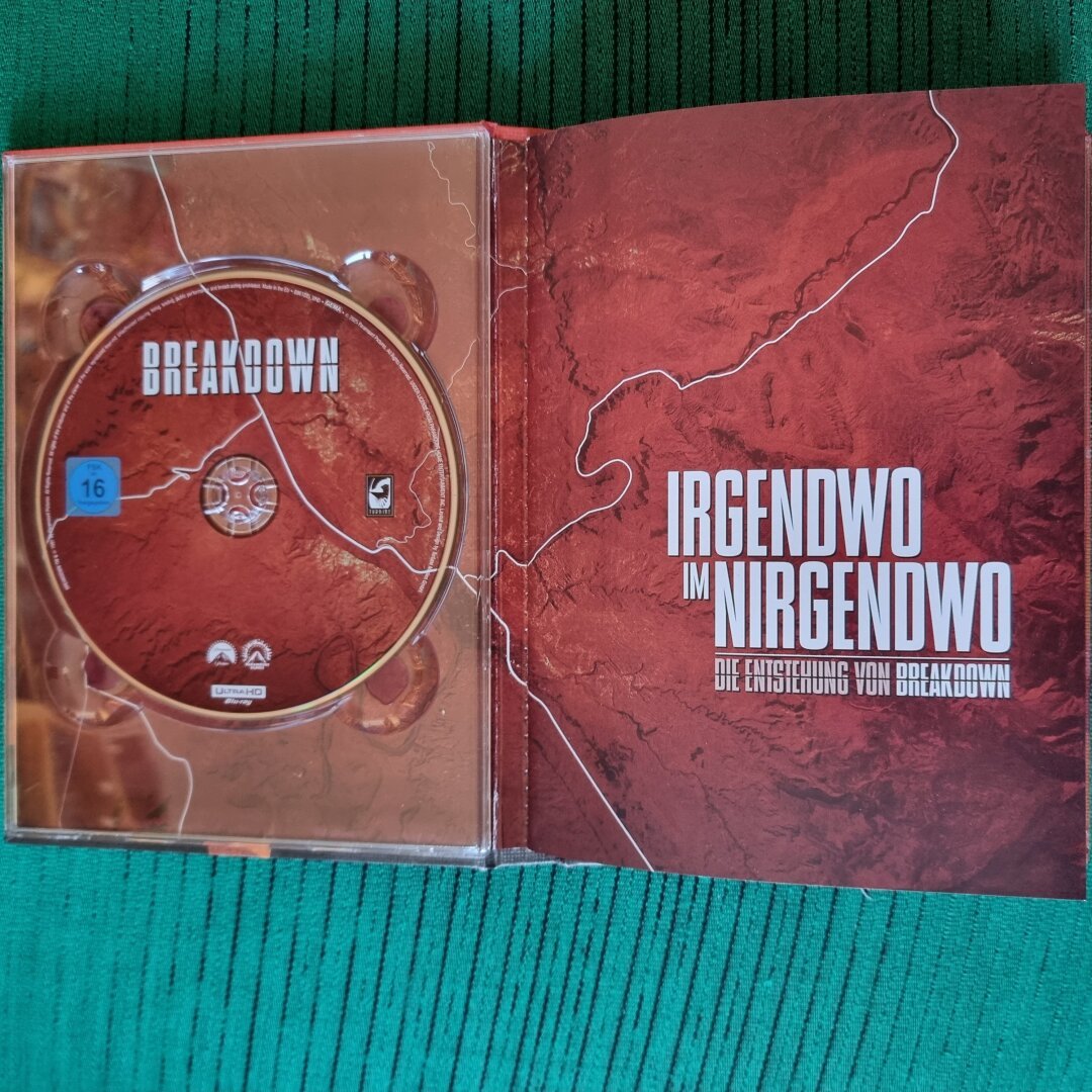 opened up mediabook (first page with the tray on the left)