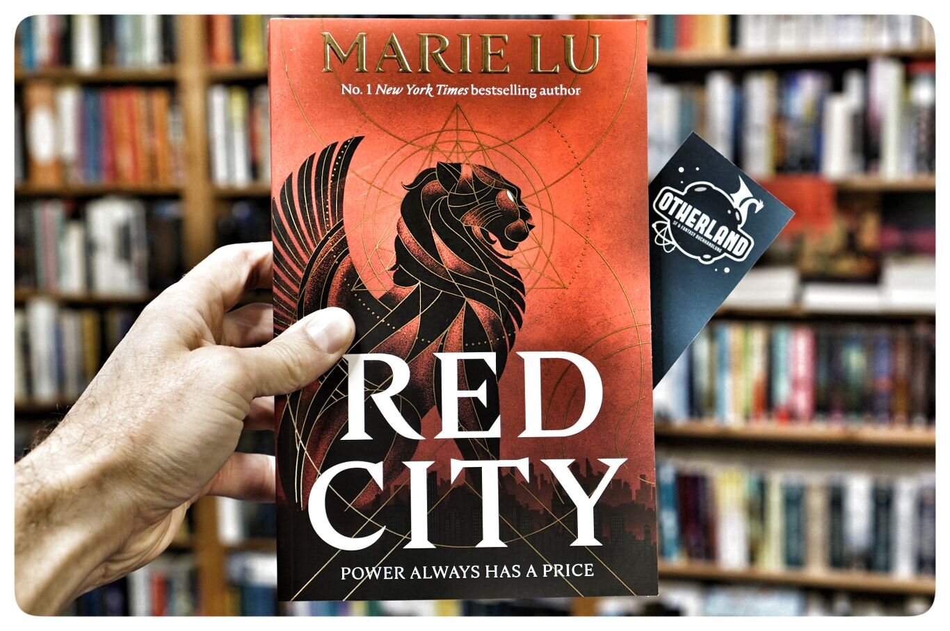 Red City
 - The New Alchemists #1
by Marie Lu

The Godfather meets The Magicians in the sweeping adult debut from #1 New York Times bestselling author Marie Lu. Perfect for fans of V.E. Schwab, Red City is a dark and deadly contemporary fantasy of magical warfare, star-crossed ambition, and the pursuit of perfection at any cost, set in a glittering alternate Los Angeles.

Alchemy is the hidden art of transformation. An exclusive power wielded by crime syndicates that market it to the world’s elites in the form of sand, a drug that enhances those who take it into a more perfect version of themselves: more beautiful, more charismatic, simply more.

Among the gleaming skyscrapers and rolling foothills of Angel City, alchemy is controlled by two rival syndicates. For years, Grand Central and Lumines have been balanced on a razor’s edge between polite negotiation and outright violence. But when two childhood friends step into that delicate equation, the city―and the paths of their lives―wil