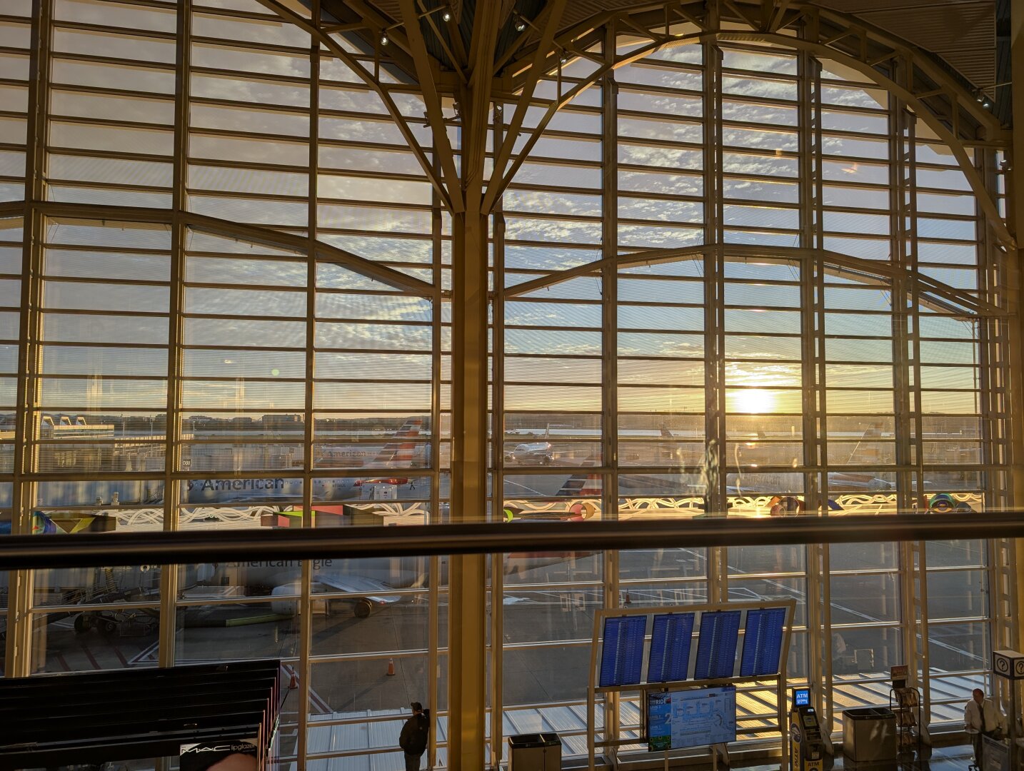 Large windows overlooking an airport runway