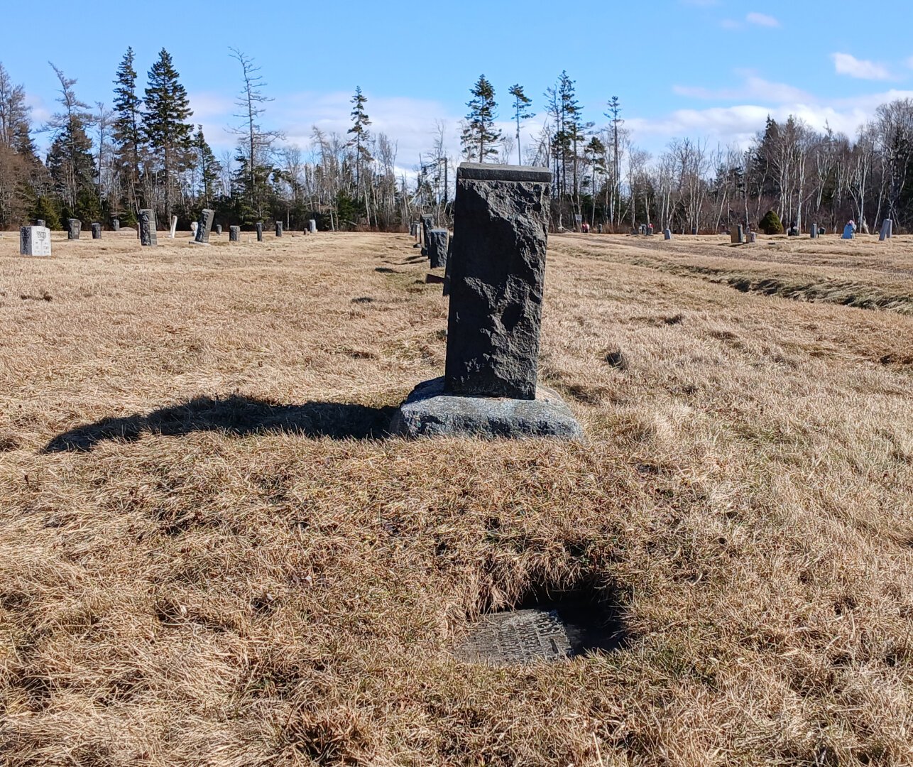 graves at the Ragged Reef cemetery in Nova Scotia