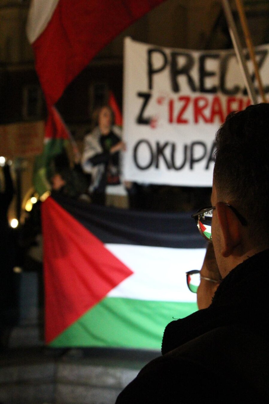 Palestinian flag from a guy's glasses during Krakow demonstration