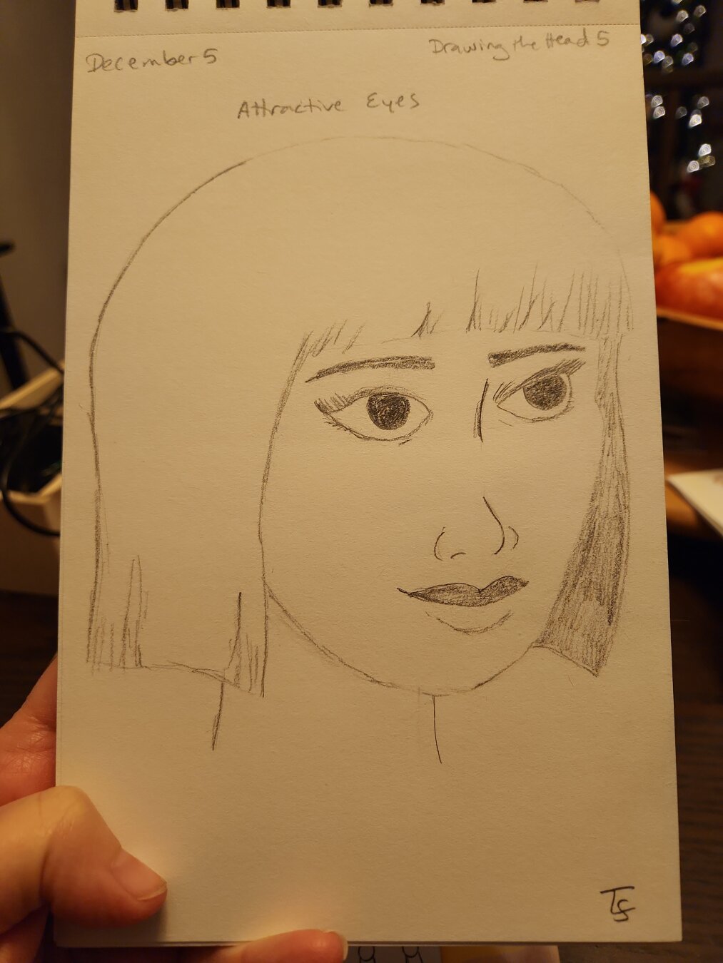 Pencil sketch of a woman looking off to the side some. She has short hair with bangs. I feel I did a bit better with the eyes than with yesterday's sketch, but am still struggling with this perspective.