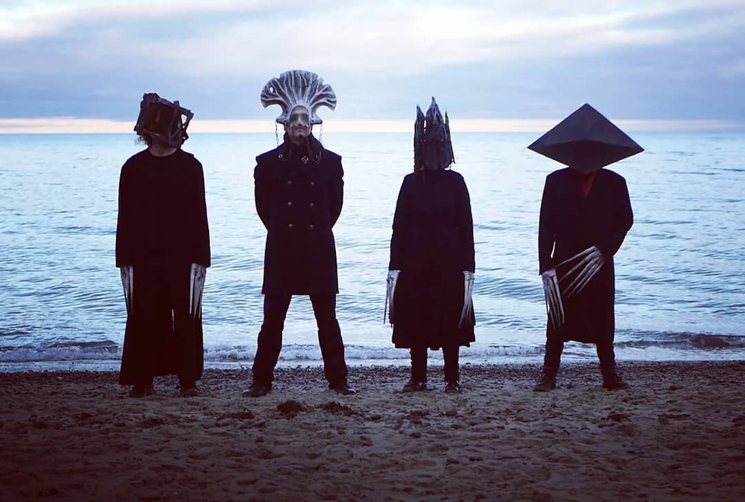 All four masked musicians stand on the beach. #Dtorn #masks #maskmaking #maskmaker #gothic www.dtorn.de