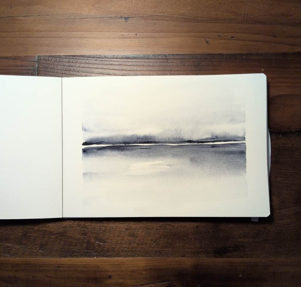 This is a minimalist horizontal atmospheric watercolor landscape painting in landscape orientation using one color sodalite genuine. There is a distinct white line at the horizon line. The masstone is diluted out above and below the white gap.