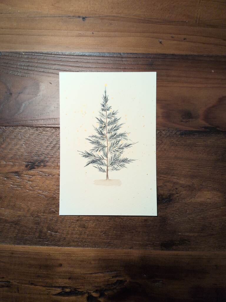 This is a watercolor painting of a pine tree. It's very simply tree with a base and some gold splatter. The center trunk is brown and the pine needles are various values of blue green.