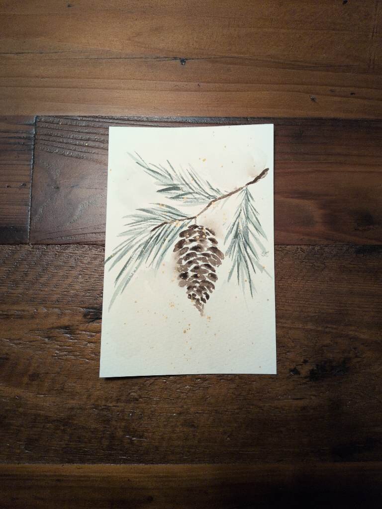 This is a watercolor painting of a branch of evergreen tree with a single pine cone hanging from it. It's painted on a 4x6 sheet of Saunders Waterford Coldpress watercolor paper. The evergreen needles are varying values of muted blue green.