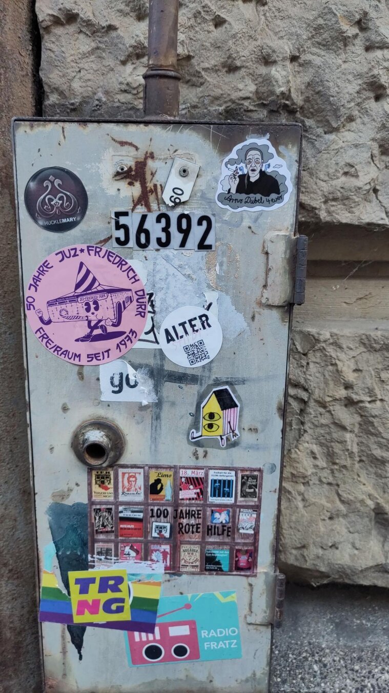 A sticker showing Arno Dübel, Germany's famous laziest person without a job.