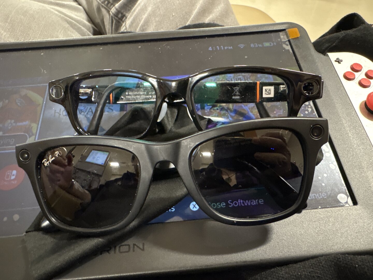 Two pairs of AI smart glasses stacked vertically. Top: Solos Krypton V with photochromic grey lenses. Bottom: Meta x Ray-Ban sunglasses in a classic Wayfarer style.
