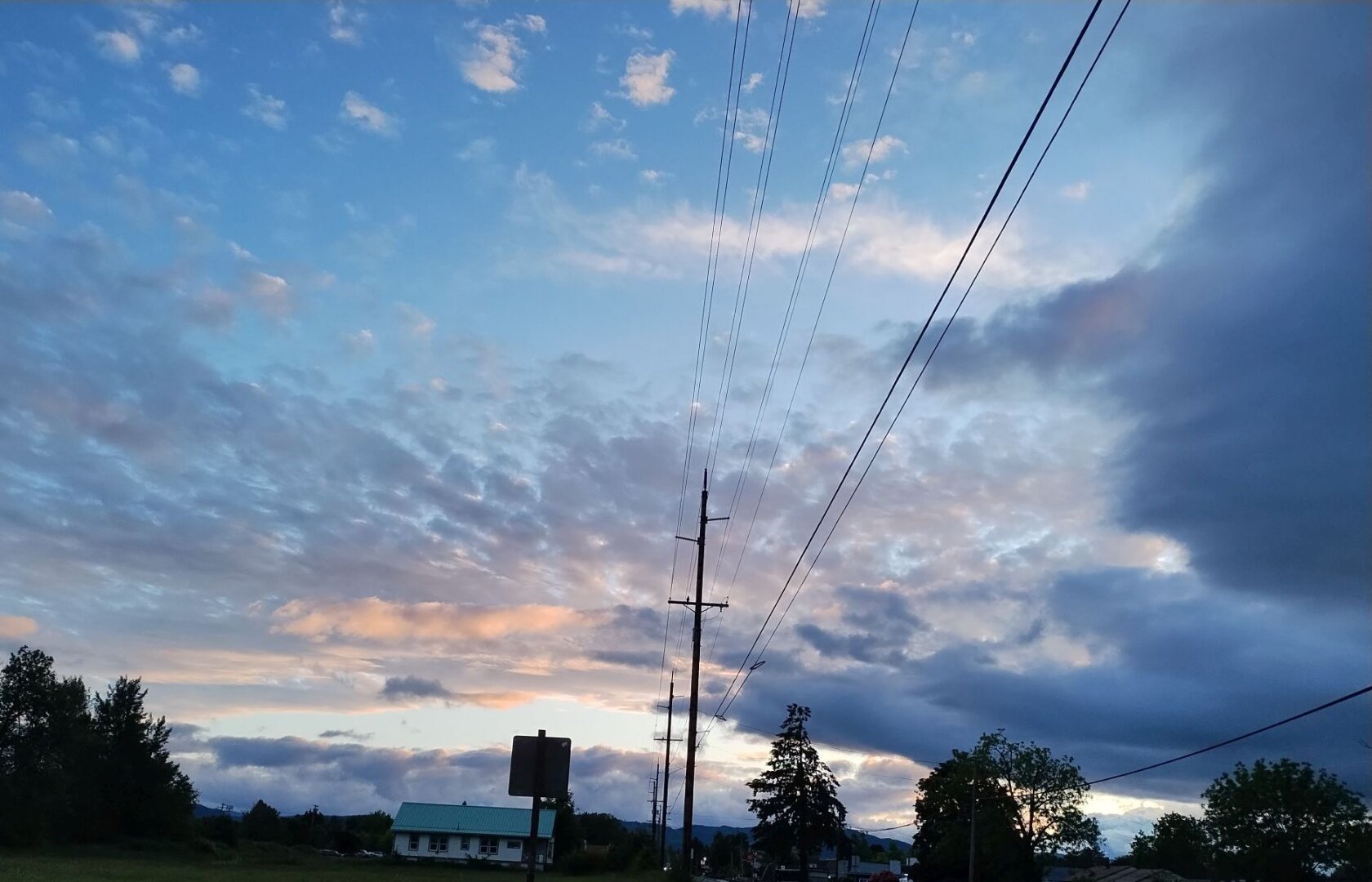 blue sky with soft clouds nearing sunset
