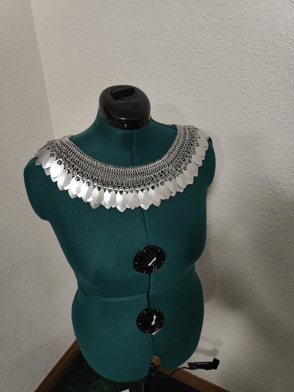 A high angled front view of the chainmail described in the post. It is modeled on a mannequin with a plain background.